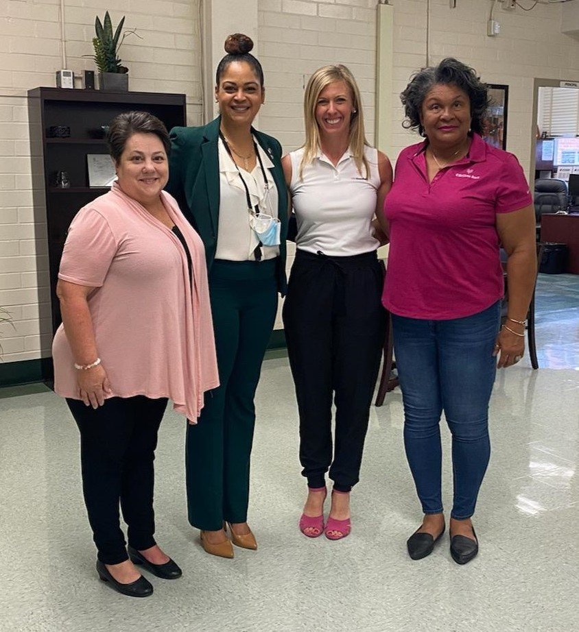 Pictured from right are Deborah Valentine, Becky Lowry, Charger Academy Principal Andrea Y. Talley and a member of the principal’s staff.
